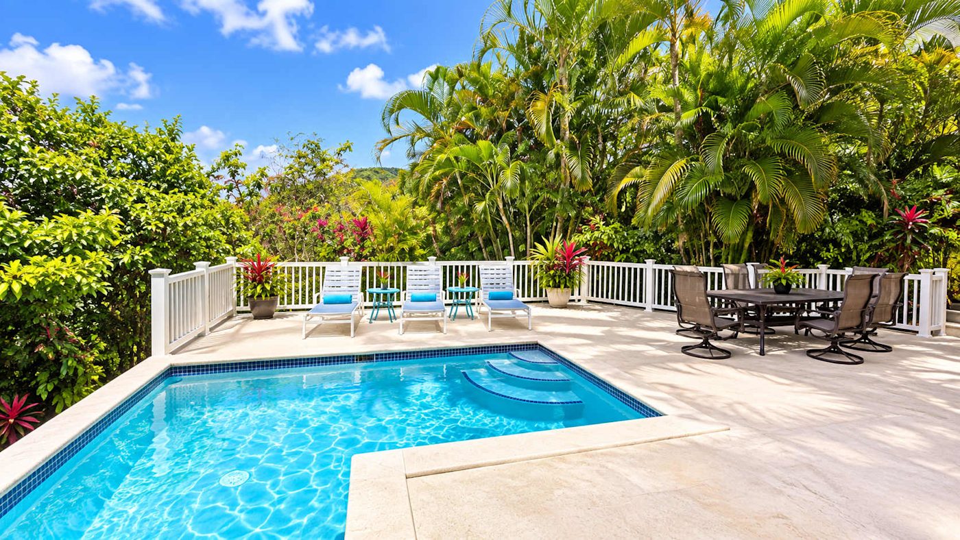 Private pool and terrace surrounded by tropical greenery